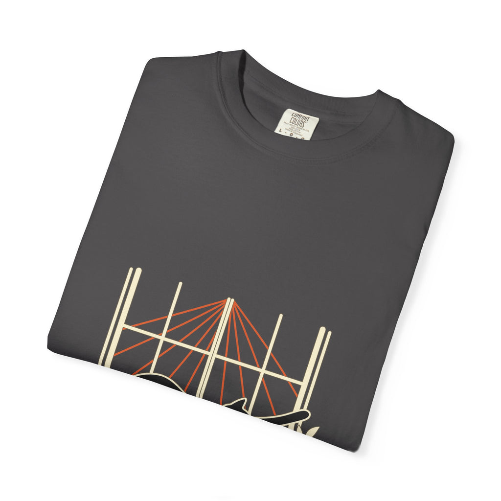 Close-up of the sunlit window print on a folded graphite Shadow & Sunlight tee