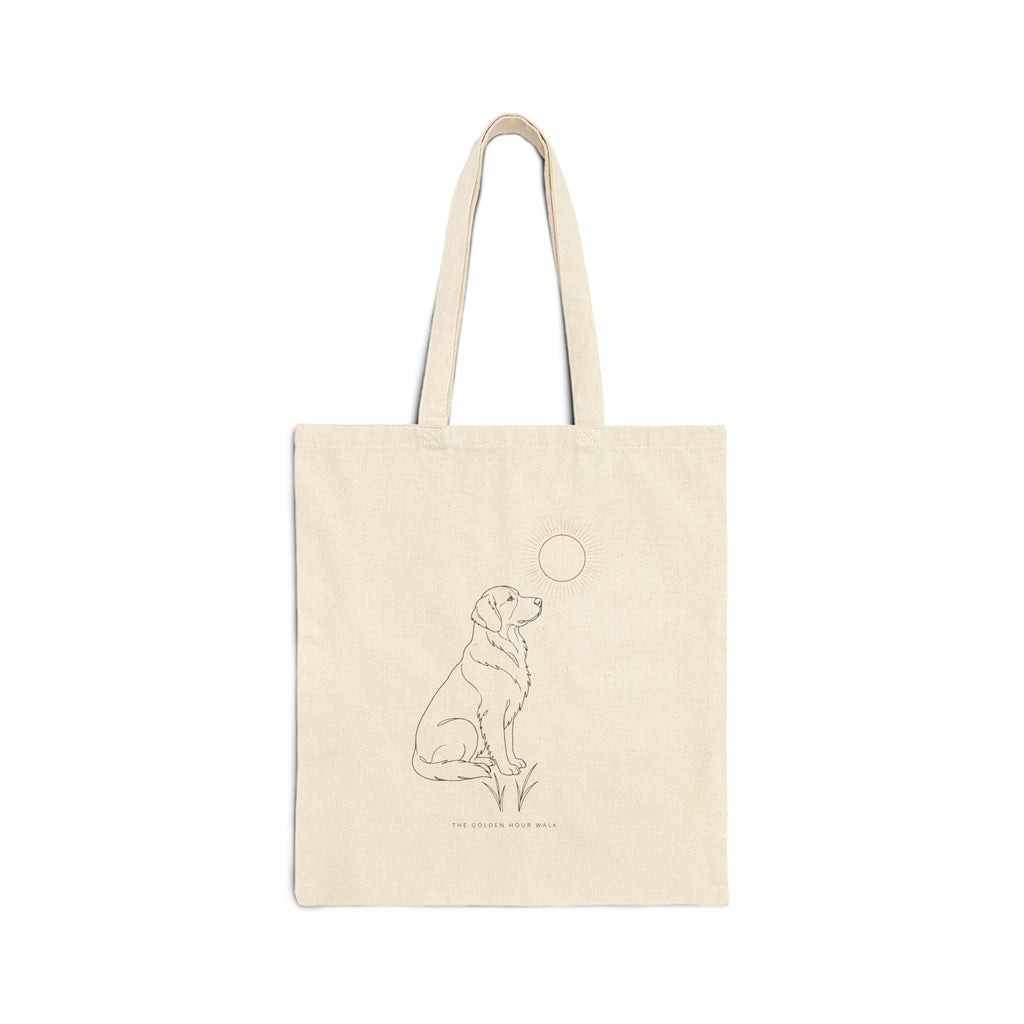 Natural canvas tote with a line drawing of a golden retriever sitting under the sun, front view