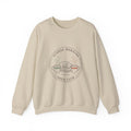 Sand Sunday Morning Sofa Club crewneck with a round badge of a dog asleep between two coffee mugs, front view