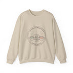 Sand Sunday Morning Sofa Club crewneck with a round badge of a dog asleep between two coffee mugs, front view