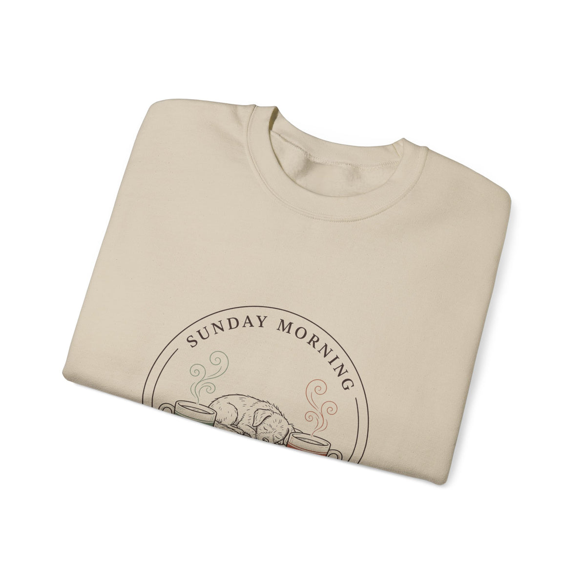 Close-up of the Sunday Morning Sofa Club badge on a folded sand crewneck