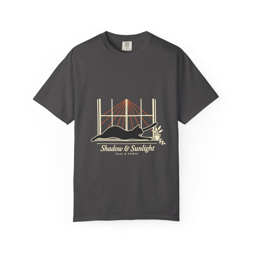 Graphite tee with a black cat stretching in a sunny window and Shadow & Sunlight lettering, front view