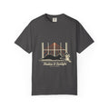 Graphite tee with a black cat stretching in a sunny window and Shadow & Sunlight lettering, front view