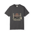 Graphite tee with a black cat stretching in a sunny window and Shadow & Sunlight lettering, front view