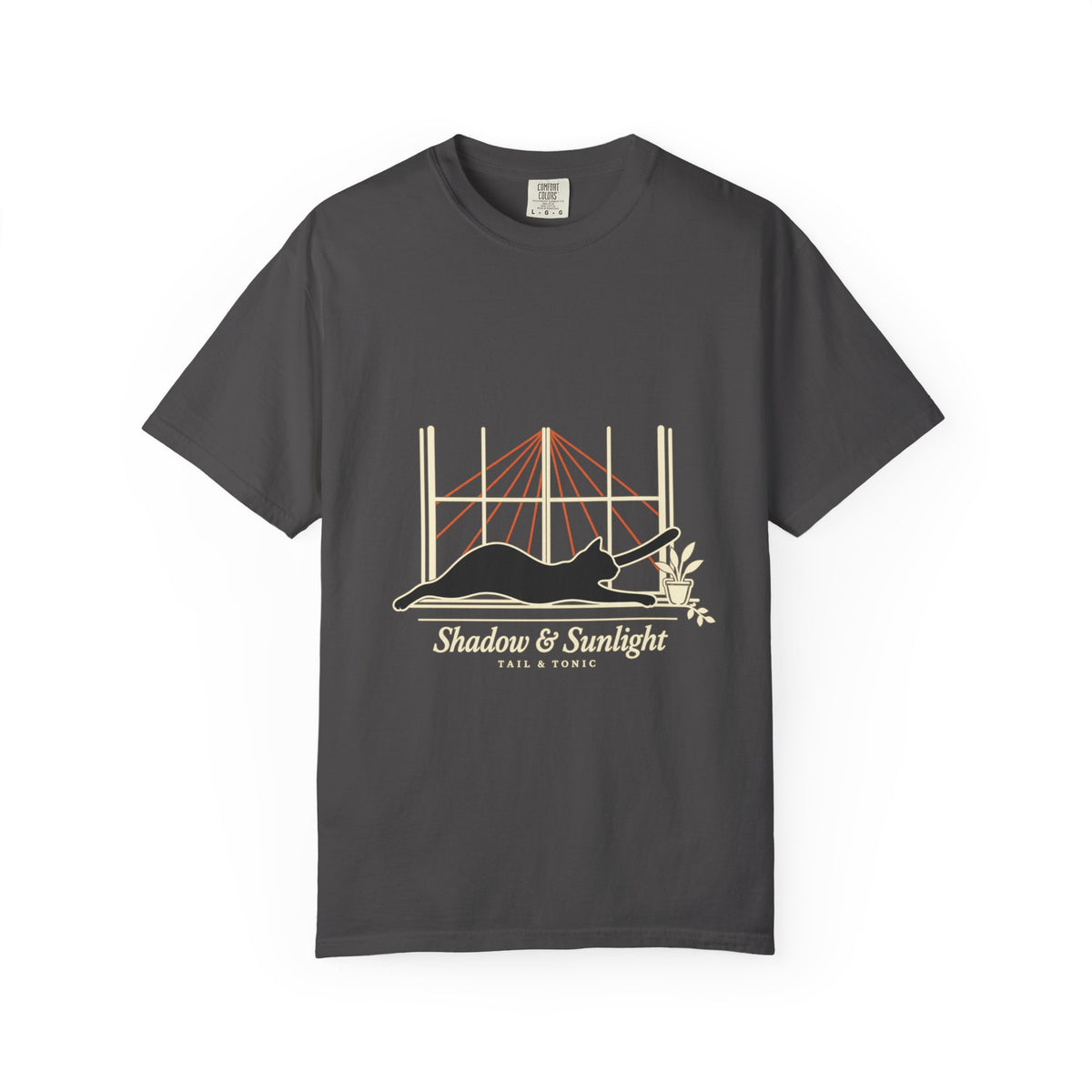 Graphite tee with a black cat stretching in a sunny window and Shadow & Sunlight lettering, front view