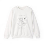 White Quiet Company crewneck with a line drawing of a cat curled up asleep on an open book, front view
